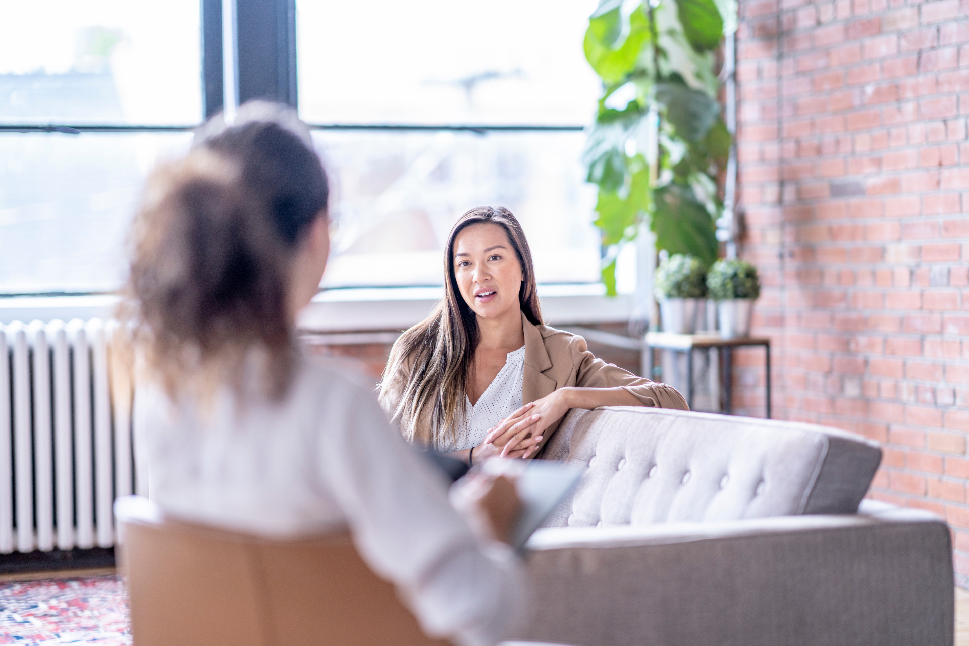 Two women talking in psychiatry office