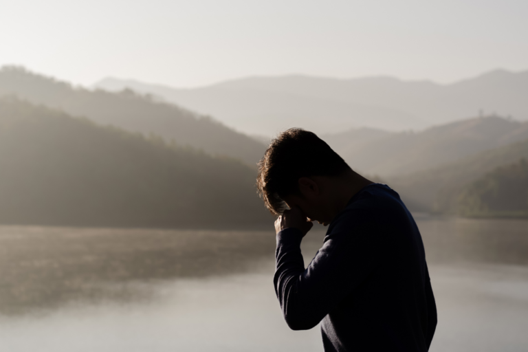 man sad with hands in forehead