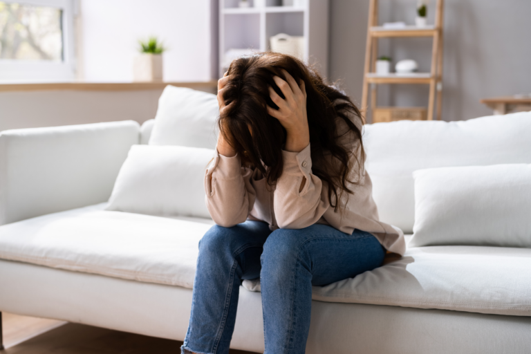 frustrated woman with hands in hair